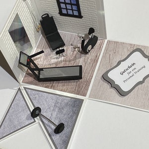 May include: A handmade pop-up card depicting a miniature gym. The card includes a treadmill, weight bench, stationary bike, and a barbell. The walls are white brick, and a window shows a blue sky. A gift certificate is also included.