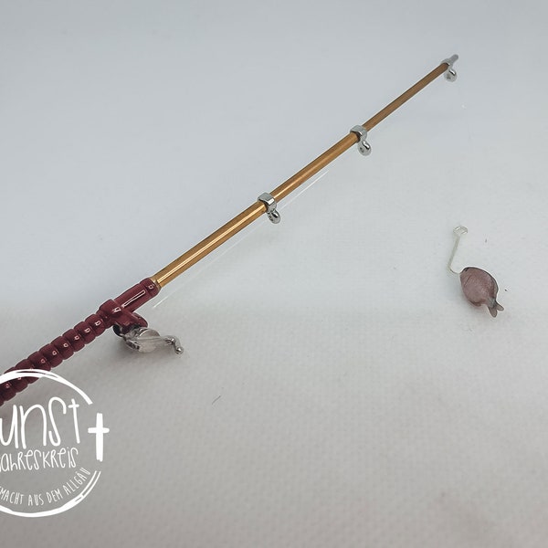 Gnome miniature fishing rod with fish on the hook