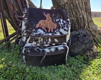 Tooled leather patch on cowhide backpack/diaper bag