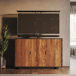 May include: A wooden cabinet with three doors and a flat-screen TV mounted above it. The cabinet is in front of a wall with vertical grooves. A potted plant is on the left side of the cabinet.