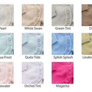 May include: A collection of baby cardigans in various colors, including Pearl, White Swan, Green Tint, Doe, Aqua Frost, Quite Tide, Splish Splash, Linden Green, Rosewater, Orchid Tint, and Magenta. Each cardigan features a button closure and a knitted design.
