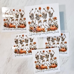 May include: Five stickers featuring a group of skeletons dancing with pumpkins and flowers. The text "Fall Breeze and Autumn Leaves" is on each sticker.