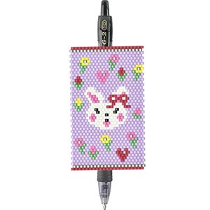 May include: A black and clear pen with a beaded purple sleeve. The sleeve features a white bunny with a red bow, surrounded by hearts and flowers. The pen is a G-2 10.