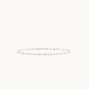 May include: A silver chain bracelet composed of a series of small, circular, faceted metallic discs linked together. The reflective surface of each individual disc catches the light, creating a shimmering effect along the entire length of the bracelet.