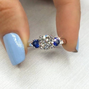 Round Moissanite diamond with side blue sapphire diamond three stone ring, 1ct round diamond ring, blue sapphire diamond ring, 1ct ring