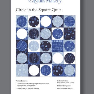 May include: A printed pattern for a quilt titled "Circle in the Square Quilt" by Catskills Makery. The quilt design features a grid of squares with blue and white circles and patterns. The pattern includes instructions for four sizes: Baby, Throw, Twin, and Queen.