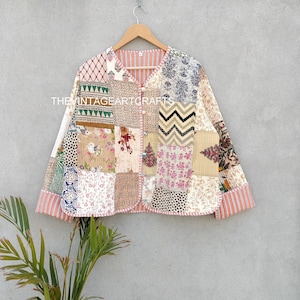 May include: A patchwork quilted jacket featuring a mix of floral and geometric patterns in beige, brown, green, and pink hues. The jacket has a button fastening and long sleeves with a striped trim.