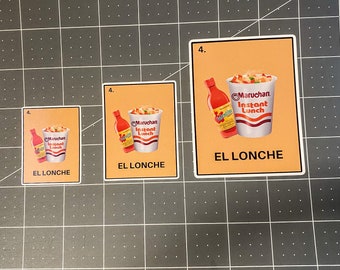 May include: A set of three stickers featuring a graphic of a cup of instant noodles and a bottle of hot sauce. The stickers have the text "EL LONCHE" and "Maruchan Instant Lunch" on an orange background.