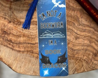 May include: Blue bookmark with a white dragon and the text "I'm not a bookworm, I'm a book dragon".
