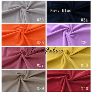 May include: A collection of 8 fabric swatches in various colors, including gray, orange, pink, yellow, beige, and red. Each swatch is labeled with a number from 33 to 40. The text "Navy Blue" is visible above the dark blue swatch labeled #34.