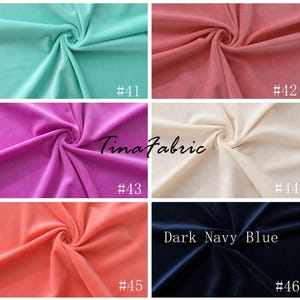 May include: Six fabric swatches in different colors: light blue, pink, cream, coral, and dark navy blue. The swatches are arranged in two rows of three. Each swatch has a number printed on it, ranging from #41 to #46. The text "Tinafabric" is printed in the center of the image.