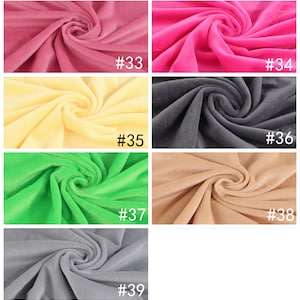 May include: A collection of fabric swatches in various colors, including red, pink, yellow, green, and gray. Each swatch is labeled with a number, from #33 to #39.