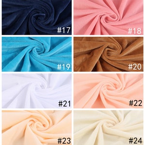 May include: Six rows of fabric swatches in different colors. The swatches are arranged in two columns. The colors are navy blue, pink, light blue, brown, white, peach, beige, and cream. Each swatch is labeled with a number from 17 to 24.