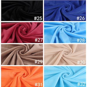 May include: Eight fabric swatches in different colors, including black, blue, red, light blue, beige, orange, and light blue. Each swatch is labeled with a number from 25 to 32.