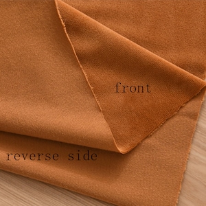 May include: A close-up of a brown fabric folded in half, showing the front and reverse side. The text "front" is written on the front side and "reverse side" is written on the reverse side.
