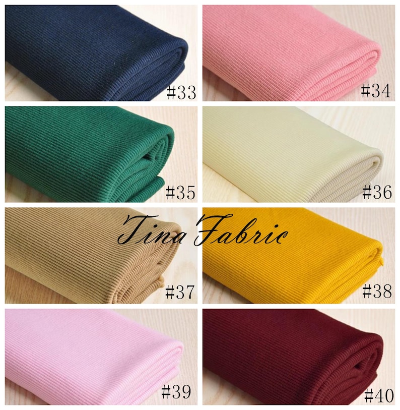 May include: A collection of ten fabric swatches in various colours, including navy blue, pink, green, beige, yellow, and burgundy. Each swatch is folded and labelled with a number from 33 to 40.