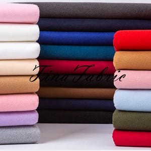 Tissu polyester brossé double face épaissi : tissu pour manteaux et habillement - mètre carré