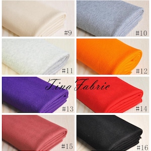 May include: A collection of 10 different colours of ribbed knit fabric. The colours are: beige, grey, light grey, orange, purple, red, coral, black, and white. The fabric is folded in half and the number of each colour is written below it.