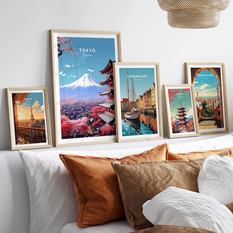 Tokyo travel poster featuring Mt. Fuji and traditional Japanese art, displayed with other city posters in a cozy home setting.