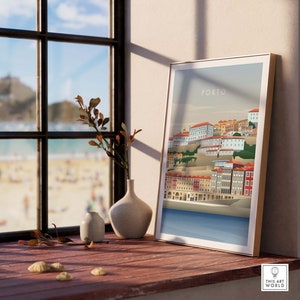 May include: A framed illustration of the city of Porto, Portugal. The illustration is in a minimalist style and features a cityscape with buildings in shades of red, orange, and yellow. The text "PORTO" is printed in white at the top of the illustration.