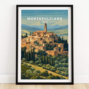 May include: A framed art print of Montepulciano, Italy. The illustration depicts a Tuscan village with terracotta rooftops, a tall bell tower, and lush green trees. The sky is a gradient of blue and the print is in a black frame.