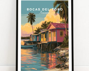 May include: Framed art print featuring a colorful coastal scene. The artwork depicts vibrant pink, yellow, and blue houses on stilts, palm trees, and a boat on the water. Text at the top reads "Bocas Del Toro Panama."