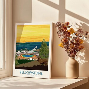 Yellowstone National Park art print on a sunlit windowsill with vase of dried flowers
