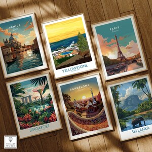 Set of six framed travel posters featuring Venice, Yellowstone, Paris, Singapore, Barcelona, and Sri Lanka, displayed on a wooden floor.
