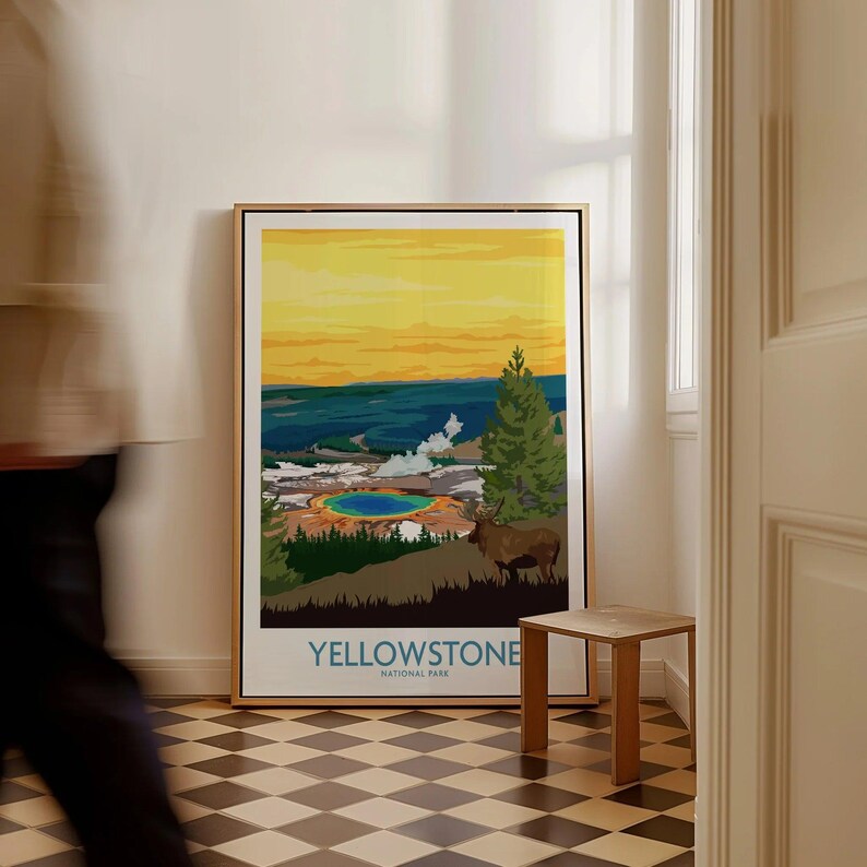 Yellowstone National Park framed travel poster with landscape art on floor in modern hallway