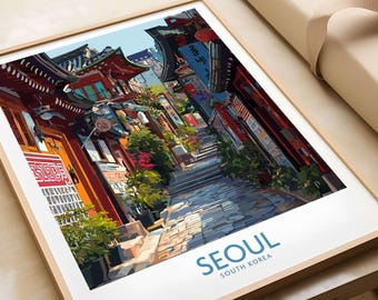 May include: A framed art print depicting a colorful street scene in Seoul, South Korea. The artwork showcases traditional architecture with red and teal accents, lush greenery, and a cobblestone path. The word "SEOUL" is printed in blue at the bottom.
