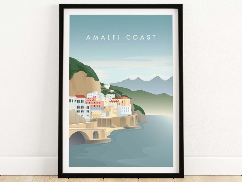 May include: A colorful illustration of the Amalfi Coast in Italy. The image features a town built into the side of a cliff with a bridge leading to the water. The text "Amalfi Coast" is printed at the top of the image.