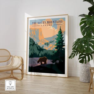 Rocky Mountains Canada framed travel poster with bear, modern wall art in a living room.