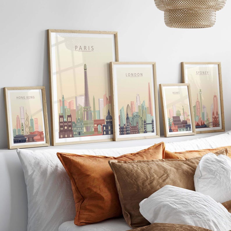 Stylish wall art featuring skyline prints of Paris, London, Hong Kong, and Sydney in pastel colors.