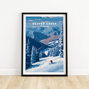 Op de afbeelding: Een ingelijste kunstprint met een winterlandschap van Beaver Creek, Colorado. Het kunstwerk toont besneeuwde bergen, groenblijvende bomen en een skiër in een rode outfit. De lucht is blauw en wit, met de tekst "BEAVER CREEK Colorado".
