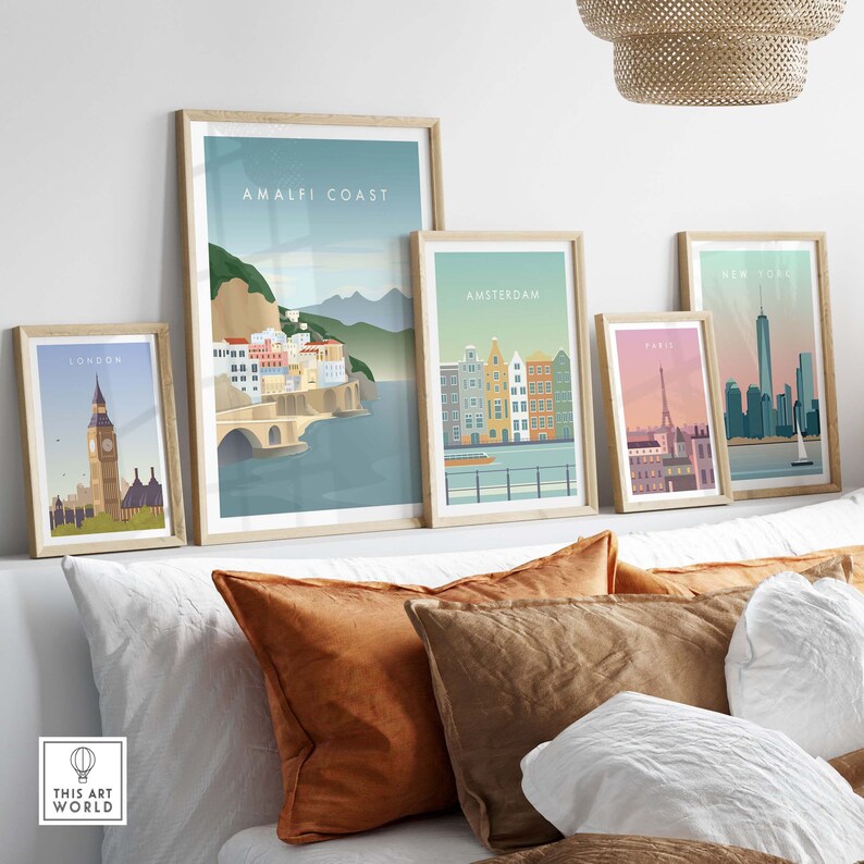 May include: Five framed illustrations of different cities around the world. The illustrations are in a minimalist style and feature iconic landmarks. The cities featured are London, Amalfi Coast, Amsterdam, Paris, and New York City.