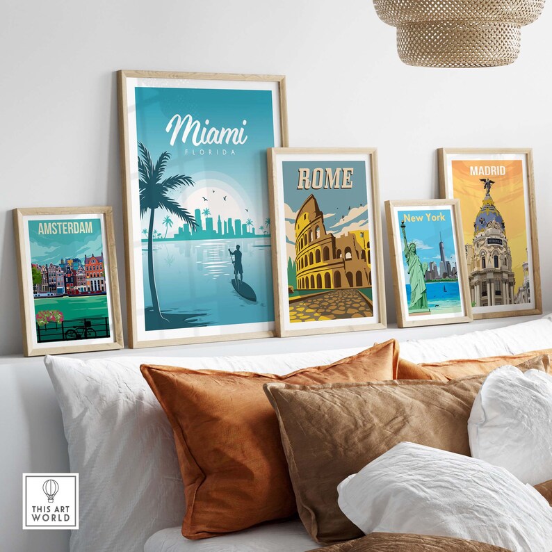 May include: Five framed travel posters with vintage-style illustrations of cities around the world. The posters feature images of Amsterdam, Miami, Rome, New York City, and Madrid.