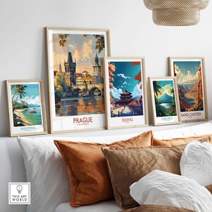 Prague Travel Poster displayed among other travel posters in a stylish home setting with decorative cushions.