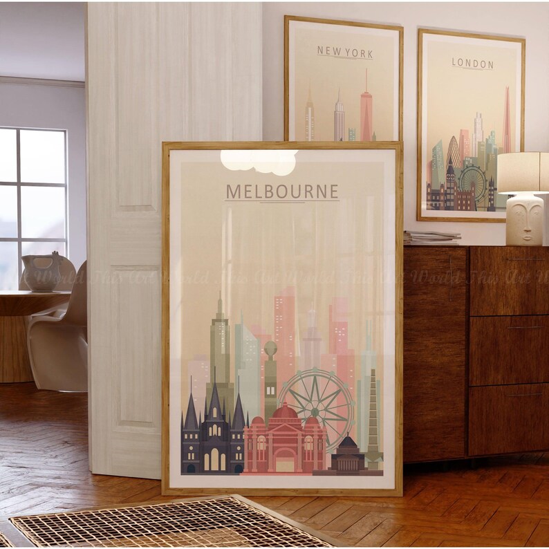 May include: A framed poster with a beige background featuring a skyline of Melbourne, Australia. The poster has the word "MELBOURNE" in large, bold letters at the top. The skyline includes the iconic Melbourne Star Observation Wheel and other buildings.