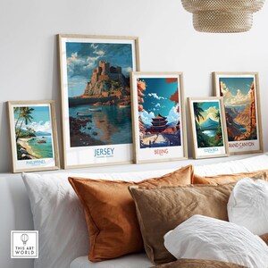 Jersey Channel Islands Art Print - Mont Orgueil Castle displayed among framed travel art prints on a cozy sofa.