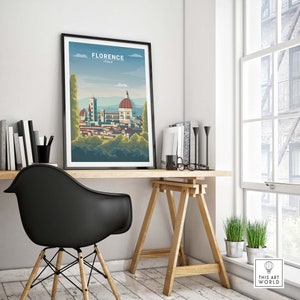 May include: A framed poster with a colorful illustration of the Florence skyline, featuring the Duomo, and the text "Florence, Italy". The poster is hanging on a white wall above a wooden desk with a black chair.