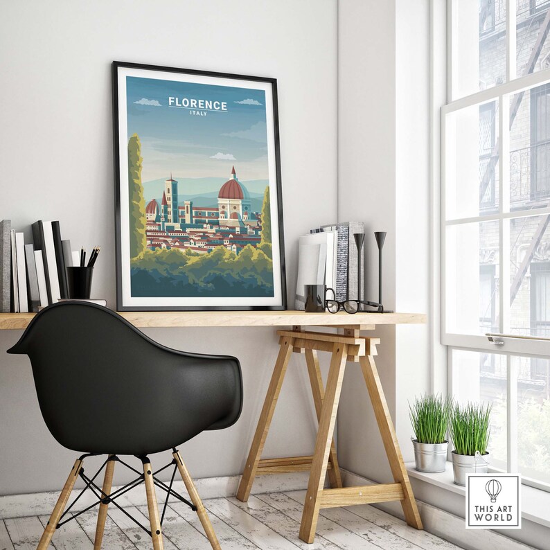 May include: A framed poster with a colorful illustration of the Florence skyline, featuring the Duomo, and the text "Florence, Italy". The poster is hanging on a white wall above a wooden desk with a black chair.