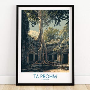 May include: Framed print of Ta Prohm temple in Cambodia. The image shows the ancient stone structure intertwined with a large tree. The print has a black frame and the text "TA PROHM CAMBODIA" at the bottom.