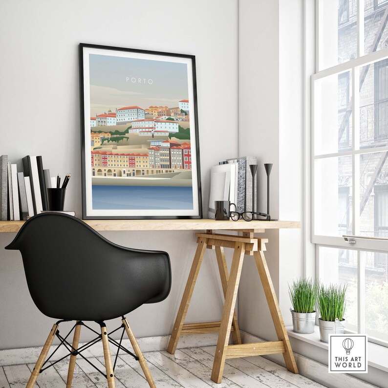 May include: A framed illustration of the city of Porto, Portugal. The illustration is in a minimalist style and features a cityscape with buildings in shades of red, yellow, and blue. The text "PORTO" is printed in white at the top of the illustration.