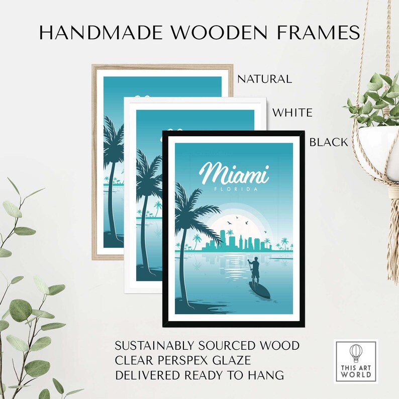 May include: A framed print of a Miami, Florida skyline with palm trees and a person paddleboarding in the water. The frame is available in natural, white, or black wood.
