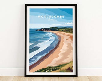 May include: A framed art print depicting Woolacombe, Devon. The image shows a beach with blue waves, a sandy shore, and green cliffs under a blue sky. The artwork is presented in a minimalist style with a black frame.