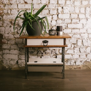 Side table of the early 20th century. Recycled furniture. Vintage and antique furniture in the style of the Middle Ages. The farmhouse