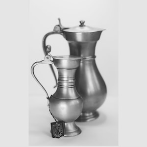 Set of 2 vintage pewter jugs (Belgium). Acorn.