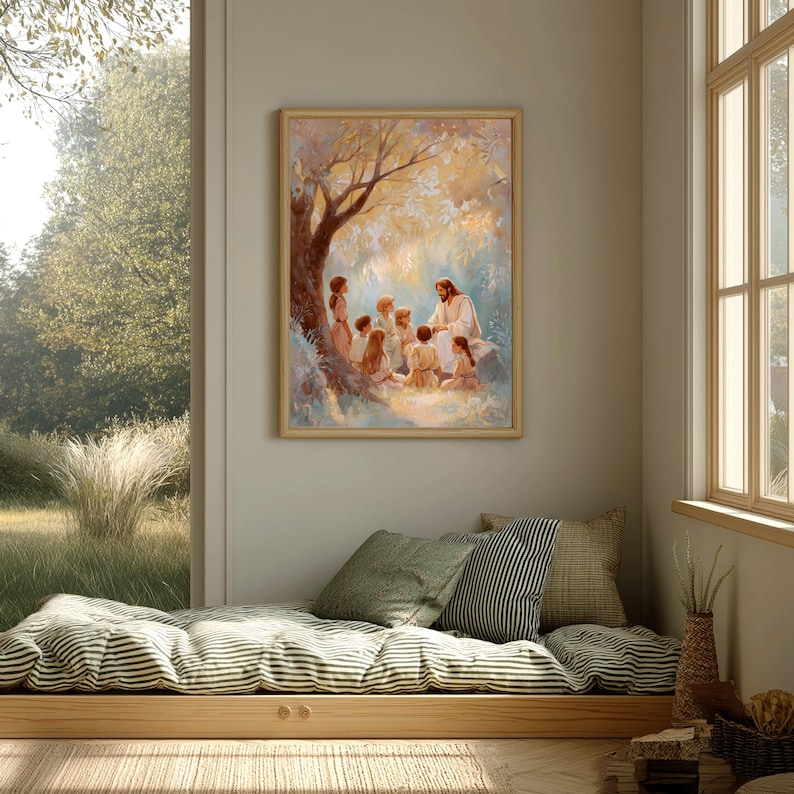May include: A framed print depicting a religious scene. The artwork shows a figure in white robes teaching a group of children under a tree. The print is in a light wooden frame and hangs on a neutral-colored wall. The room has a window and a built-in daybed.