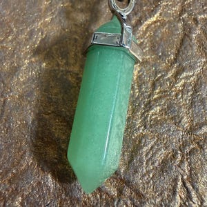 May include: A rustic wooden sign with the text "Welcome to our home" in white lettering. The sign features a distressed finish and a simple, inviting design, perfect for entryway decor.