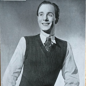 May include: Black and white photograph of a man wearing a ribbed knit waistcoat with a V-neck. The waistcoat is made with 6 ounces of 3-ply yarn. The photo is from a vintage knitting pattern leaflet titled "Weldons Leaflet No. 276 Man's Ribbed Pullover 3d."